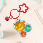 Acrylic kechain with orange hardware and bell of colorful summer bombard lanterns.